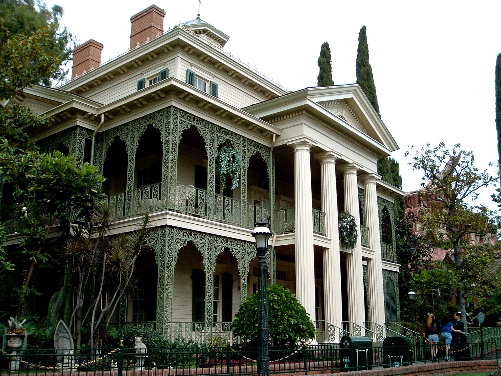Three-quarter view of the mansion with chimneys and belvedere